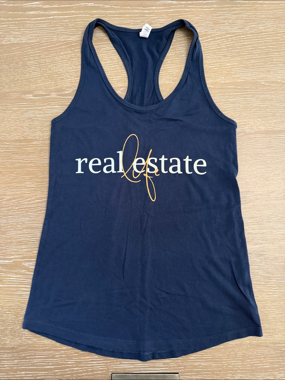 Next Level Apparel Navy Racerback Tank with REAL ESTATE life Graphic